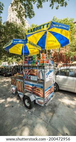 NEW YORK - JUNE 16: hot dog vendor by Washington Square Park on June 16, 2014 in New York. Washington Square Park is one of the best-known of New York City's 1,900 public parks.