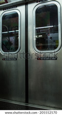 NEW YORK - JULY 14, 2014: MTA subway train doors and windows in New York. The NYC Subway is a rapid transit/transportation system in the City of NY.