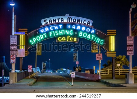 SANTA MONICA - JAN 14, 2015: Santa Monica Yacht Harbor Sport Fishing and Boating Entrance Sign in Los Angeles California at Night. Santa Monica is a beachfront city in Los Angeles California.