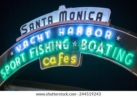 SANTA MONICA - JAN 14, 2015: Close Shot of Santa Monica Yacht Harbor Sport Fishing and Boating Sign in Los Angeles California at Night. Santa Monica is a beachfront city in Los Angeles California.