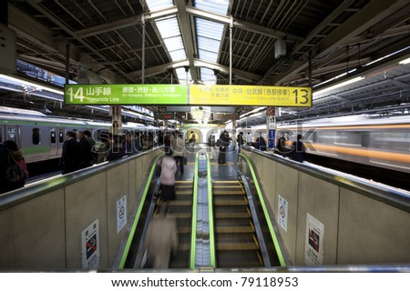 TOKYO - NOVEMBER 17: Rush hour commuters at a stop on the Tokyo Transit system in Tokyo, Japan on November 17, 2009. The transit system carries almost an average of 8 million passengers daily.