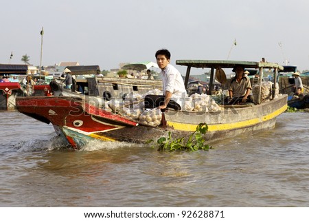 CAN THO, VIETNAM-JAN 7: Unidentified Vietnamese selling produce at the Floating Market in Can Tho, Vietnam on January 7, 2012. Cai Rang Market is the biggest floating market in the Mekong Delta