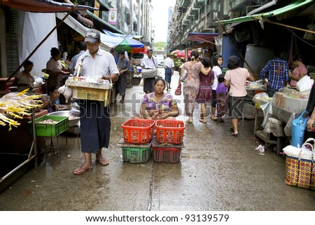 YANGON, MYANMAR - OCT 16: Street vendors in the streets of Yangon, Myanmar on October 16, 2011. Yangon was founded as Dagon in the early 11th century (c. 1028–1043) by the Mon People