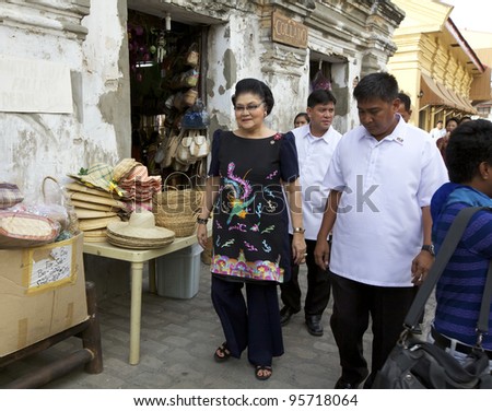 VICAN CITY, PHILIPPINES - FEB 19: Former Philippines First Lady Imelda Marcos shopping amongst supporters in Vican City, Philippines on February 19, 2012. She is widow of President Ferdinand Marcos