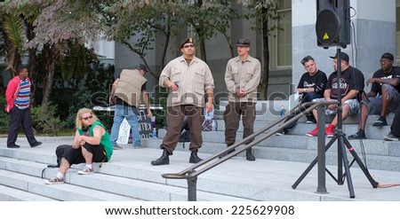 SACRAMENTO, CALIFORNIA - October 22: Protesters and Brown Berets gather at the State Capital Building to demonstrate against police brutality in Sacramento, California on October 22, 2014