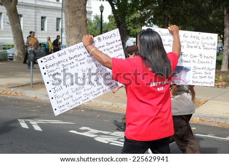 SACRAMENTO, CALIFORNIA - October 22: Protesters march to demonstrate against police brutality in Sacramento, California on October 22, 2014