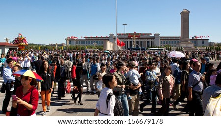 BEIJING-OCT 2: Visitors crowd Tiananmen Square on Oct 2, 2013 in Beijing, China. The National Day on October 1st marked the 64st anniversary of the founding of the People\'s Republic of China.