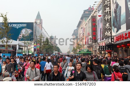BEIJING - OCT 4: People crowd Wangfujing Street during National Day holiday on Oct. 4, 2013 in Beijing, China. China's celebrates 64th anniversary of founding