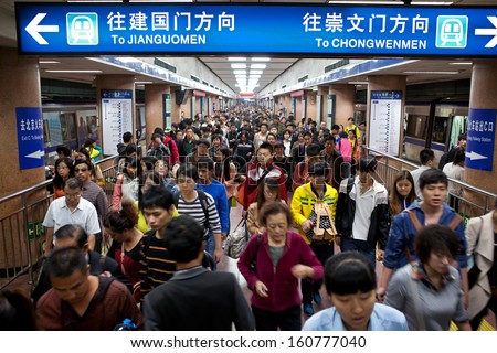 Beijing-Oct 4: Passengers Crowd A Subway Station During National Day Holiday On Oct. 4,2013 In Beijing, China. Beijing\'S 14 Subway Lines Carry Over 8.5 Million Passengers On An Average Weekday.
