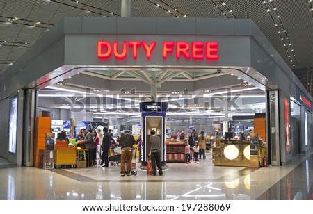 BEIJING, CHINA-JAN.23, 2014: People seen at a Duty free shop at Beijing Capital International Airport. As of 2014, this airport is the busiest airport in the world in terms of passenger throughput