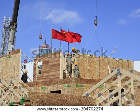 BEIJING, CHINA-MARCH. 24, 2011: Construction workers are seen on site. In China, it\'s estimated that, 90% of the 40 million construction workers were migrant workers at the end of 2006