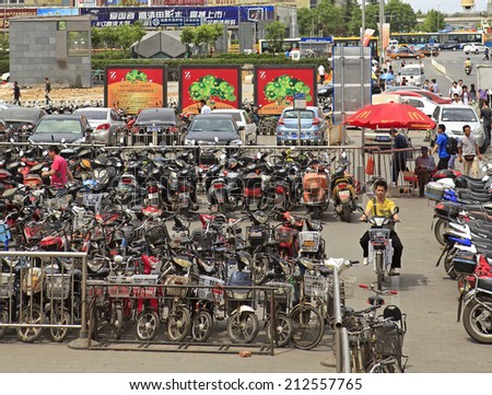 BEIJING, CHINA-MAY. 14, 2011: A rider is seen at a parking lot on Zhongguancun area.  China's bicycle production increased by 1.9% to 24.17 million units from January to May this year.