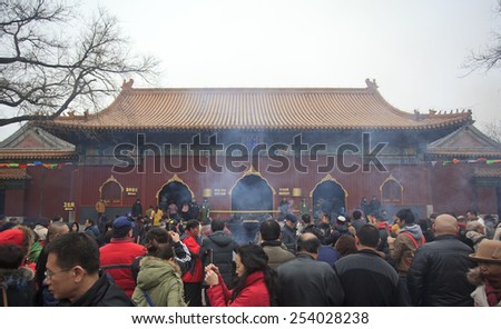 BEIJING, CHINA - FEBRUARY 19, 2015: People crowded Yonghegong Lama Temple on the first day of the Chinese Lunar New Year, the year of the sheep, which started on February 19 this year.
