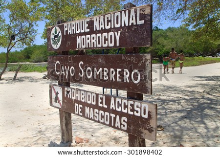 FALCON, VENEZUELA-JUL 26, 2015: Wooden signpost for Cayo Sombrero in Morrocoy National Park. This park includes an area of mangroves and several islets or cays.
