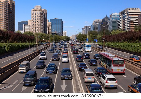 BEIJING, CHINA - SEPTEMBER 12, 2015: City skyline and Traffic on second ring road; It\'s reported that Beijing had the worst traffic congestion in China in the second quarter.