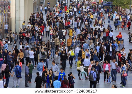 BEIJING, CHINA - OCTOBER 3, 2015: Unidentified people crowd Xidan commercial area during the National Day holiday, the 66th anniversary of the founding of the People's Republic of China.