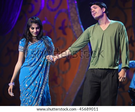 BEIJING - JANUARY 31: An Indian couple perform a romantic scene on stage during Indian Music and Dance Show at Beijing Exhibition Theater on January 31, 2010 in Beijing, China.