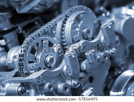 Closeup of car engine chain and gears
