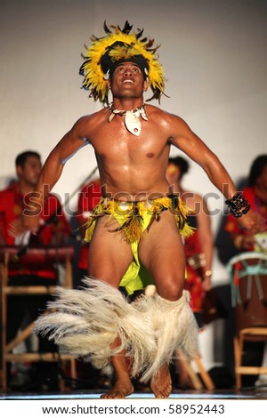 SHANGHAI - AUGUST 5: Artists from Cook Islands, in colorful costumes, perform on stage during Cook Islands Oire Nikao Dance event at Shanghai World Expo 2010 on August 5, 2010 in Shanghai, China