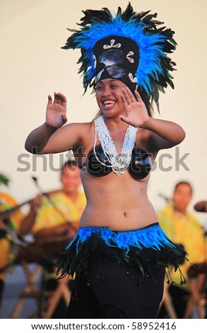SHANGHAI - AUGUST 7: Artists from Cook Islands, in colorful costumes, perform on stage during Cook Islands Oire Nikao Dance event at Shanghai World Expo 2010 on August 7, 2010 in Shanghai, China