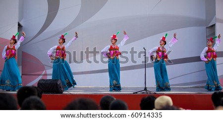 SHANGHAI - SEP 06: Pyongyang Arts Troupe performs on stage during the DPRK National Pavilion Day celebrations at Shanghai World Expo 2010 on Sept 06, 2010 in Shanghai, China