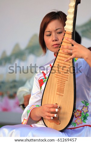 SHANGHAI - SEP 06: Musicians perform on stage during the Folk Culture of Jinshan-Local Residents Activities event at Shanghai World Expo 2010 on Sept 06, 2010 in Shanghai, China