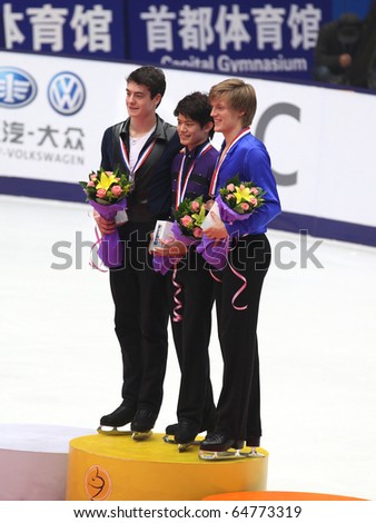 BEIJING-NOV 6: Medalists pose after Men\'s medal ceremony of the SAMSUNG Cup of China ISU Grand Prix of Figure Skating 2010 on Nov 6, 2010 in Beijing, China