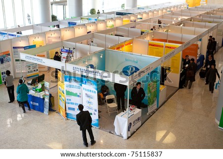 BEIJING MARCH 24 Visitors look at posters and exhibition during the 3rd Annual International Congress of Antibodies on March 24 2011 in Beijing China BEIJING MARCH 24 Visitors look at posters and exhibition during the 3rd Annual International Congress of Antibodies on March 24 2011 in Beijing China