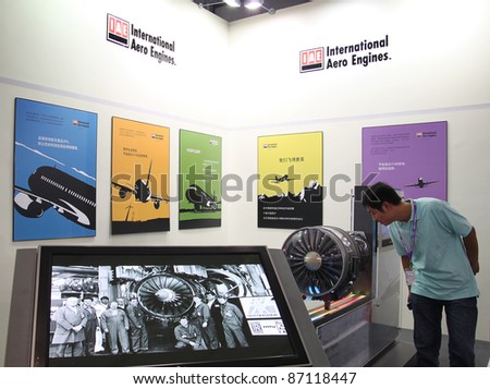 BEIJING-SEPTEMBER 25: A visitor is seen looking at the International Aero Engines exhibition area during 13th Beijing International Aviation & Aerospace Exhibition on September 25, 2009 in Beijing, China