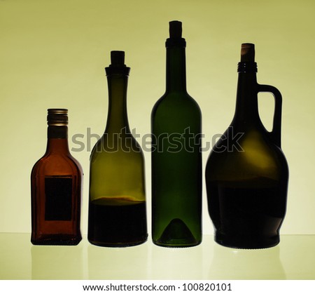Bottles of wine and liquors Yellow background