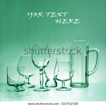 Broken glasses of wine and beer