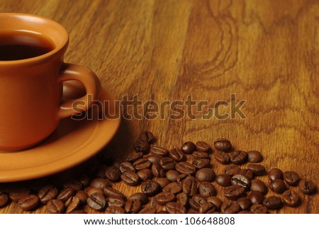 Coffee Border design. Cup of coffee and beans on the wooden table