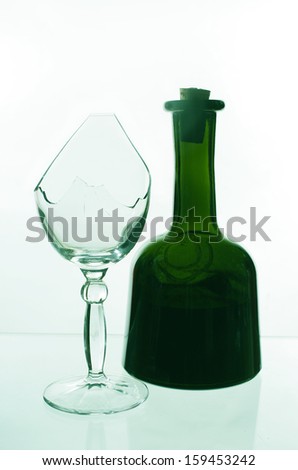 Bottle of wine and broken glass