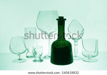 Bottle of wine and broken glasses
