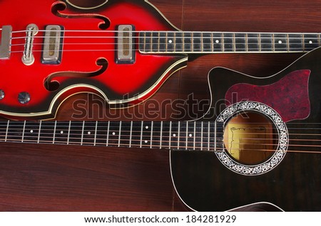 Bass  electric guitar and western guitar on wooden background