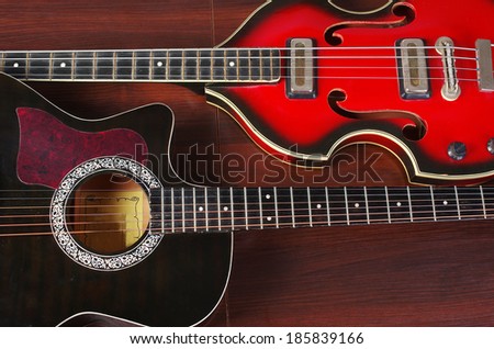 Bass  electric guitar and western guitar  on wooden background