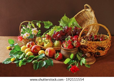 Fresh fruits, berries and flowers in the basket