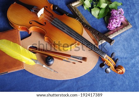 Attributes of arts: music, painting, literature. Violin, flute, pen,  palette, brushes, frame, lilac