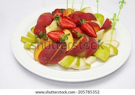 Fruit salad with strawberries, apples and peaches