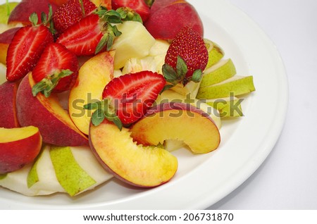 Fruit salad with strawberries, apples and peaches