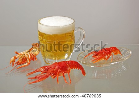 Beer and crayfishes. One beer goblet and three crayfishes
