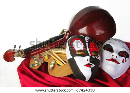 Attributes of Arts: music, painting, theater. Palette, masks, brushes, mandolin, flute
