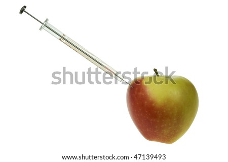 apple and syringe isolated on white background, concept of genetically modified food