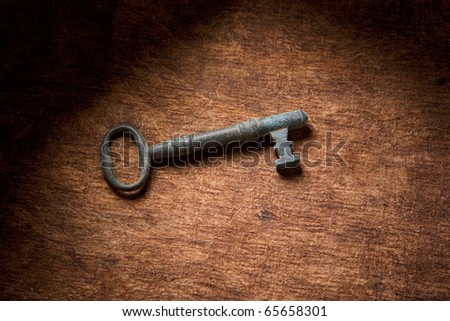 antique key on a dark brown background