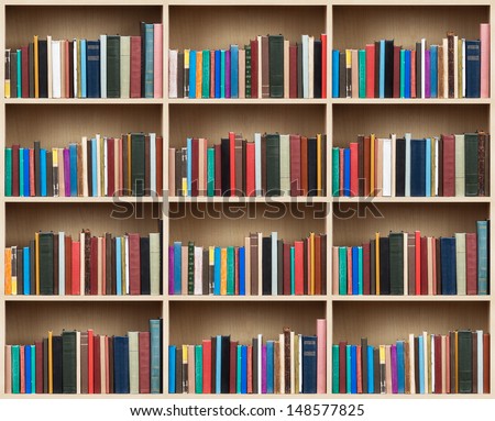 Books on a wooden shelfs.