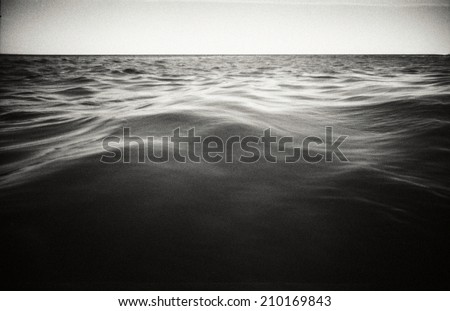 Abstract seascape background. Original film shot. Image contains grain and blur.