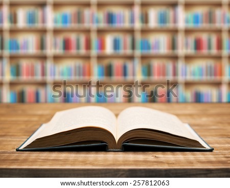 Open book on the table in shallow focus.