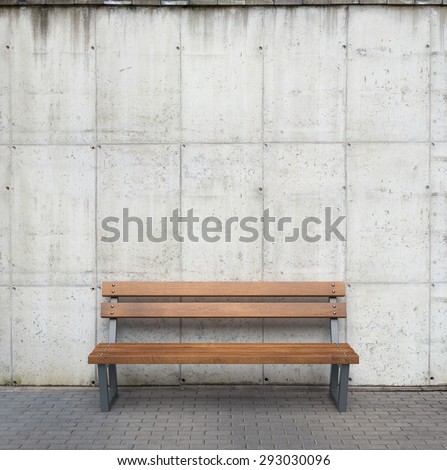 Bench against concrete wall