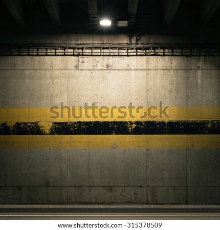 Concrete garage wall with spotlight