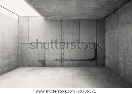 Empty warehouse room with concrete walls and floor.